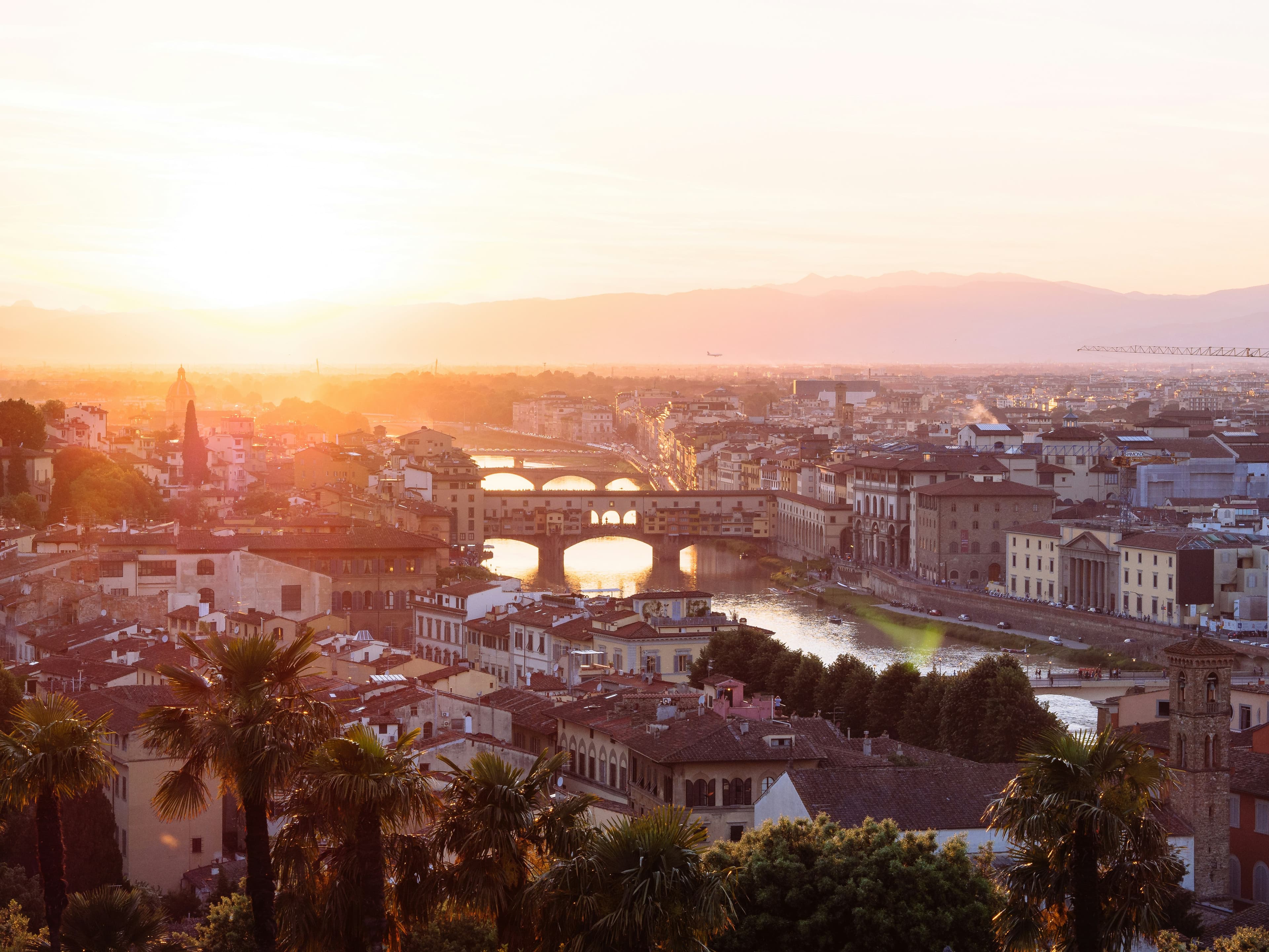 Sunset over Italian city and river