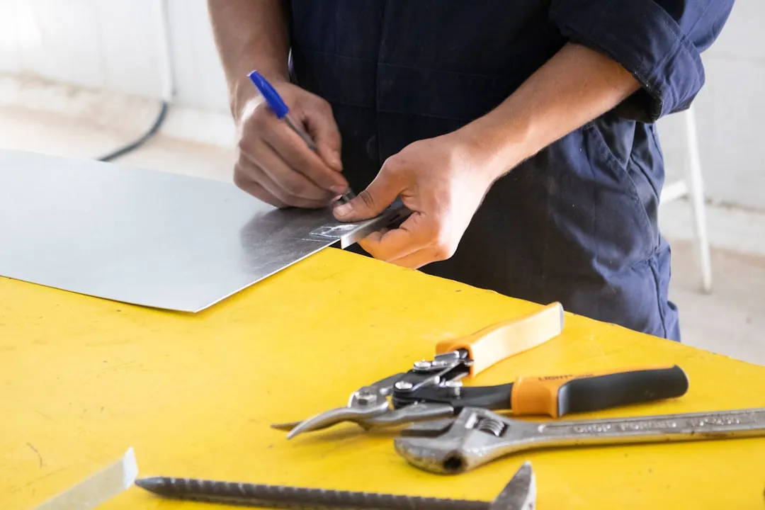 Tradesperson measuring material during renovation work